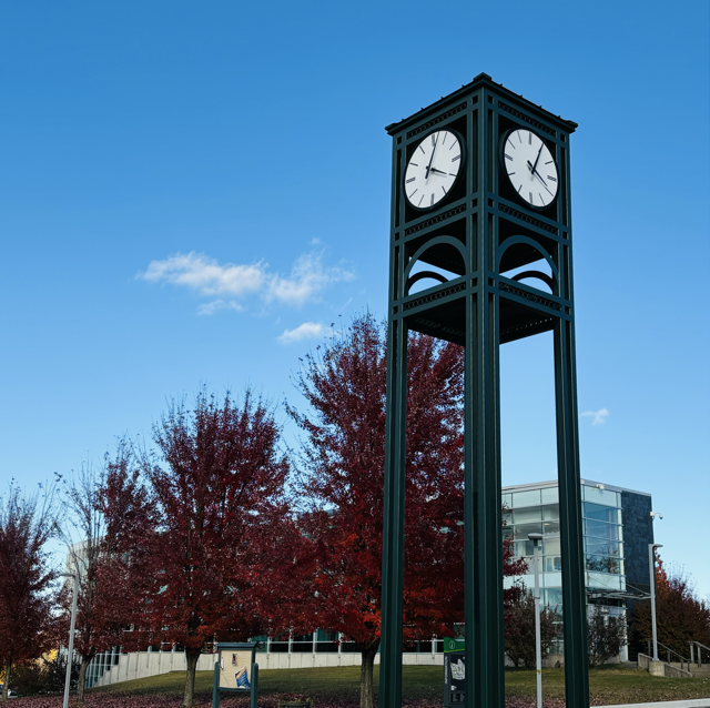 Photo of a clock tower with trees in the background at Hudson Valley Community College